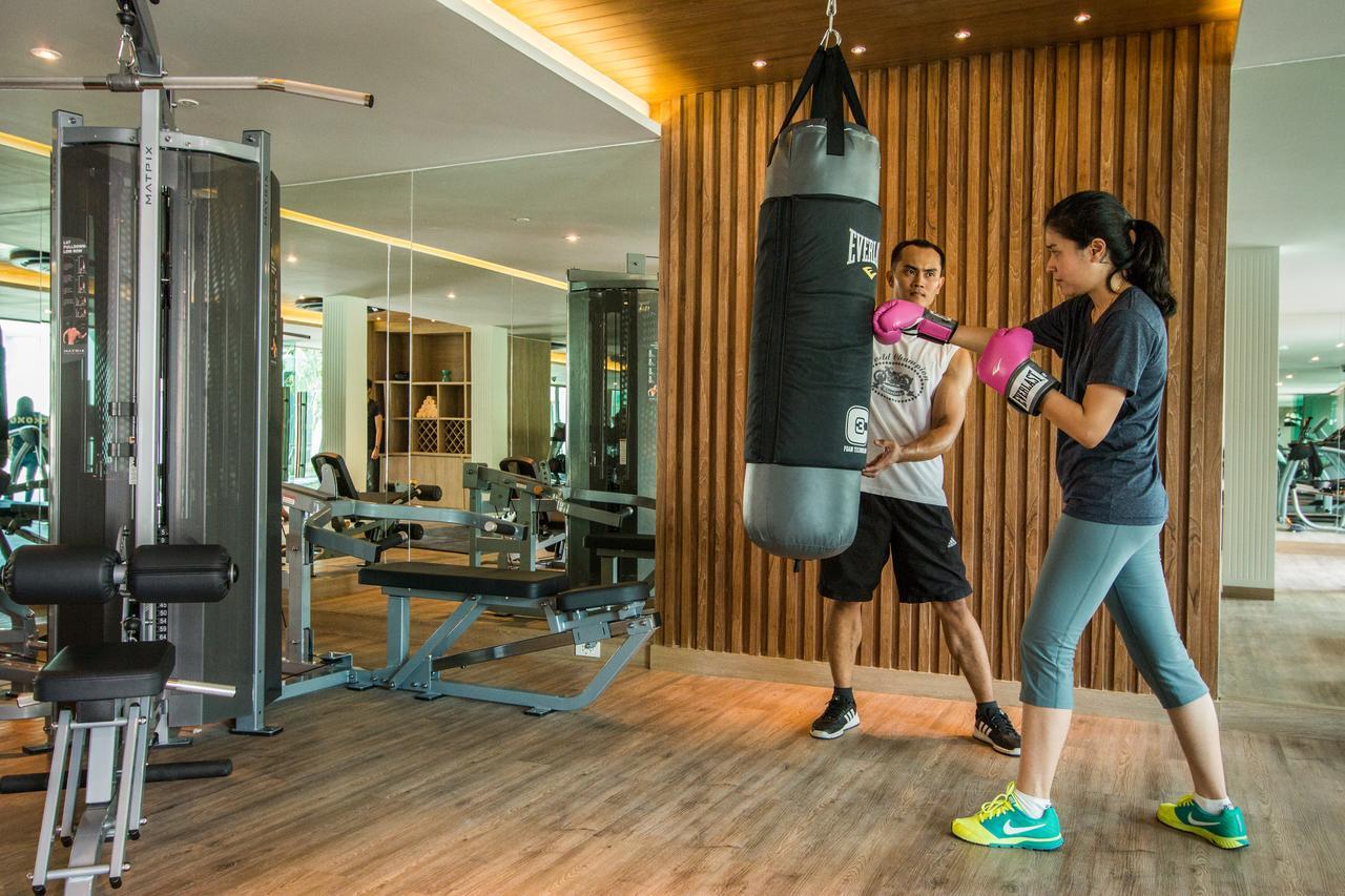 Fusion Suites Phuket Patong Luaran gambar A woman training with a personal trainer